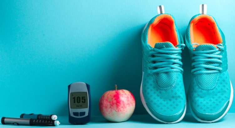 Image with shoes, apple, sugar monitor and insulin